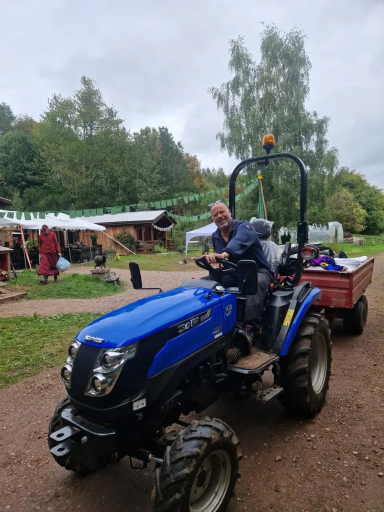 Local volunteer Nairn, Inverness, Forres on a blue tractor.